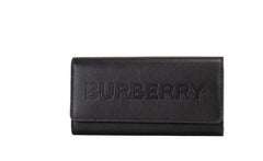 Cartera de mano Burberry Porter de piel granulada negra con logo grabado y solapa