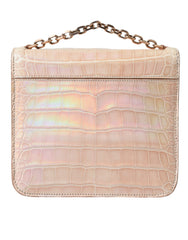Elegante mini clutch beige con cadena de Balenciaga para una noche elegante