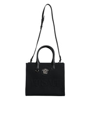 Bolso tote cruzado Versace de lona y cuero con asa superior en color negro y logotipo