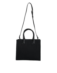 Bolso tote cruzado Versace de lona y cuero con asa superior en color negro y logotipo
