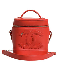 Bolso de mano con cadena y diseño de coco naranja de Chanel