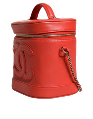 Bolso de mano con cadena y diseño de coco naranja de Chanel