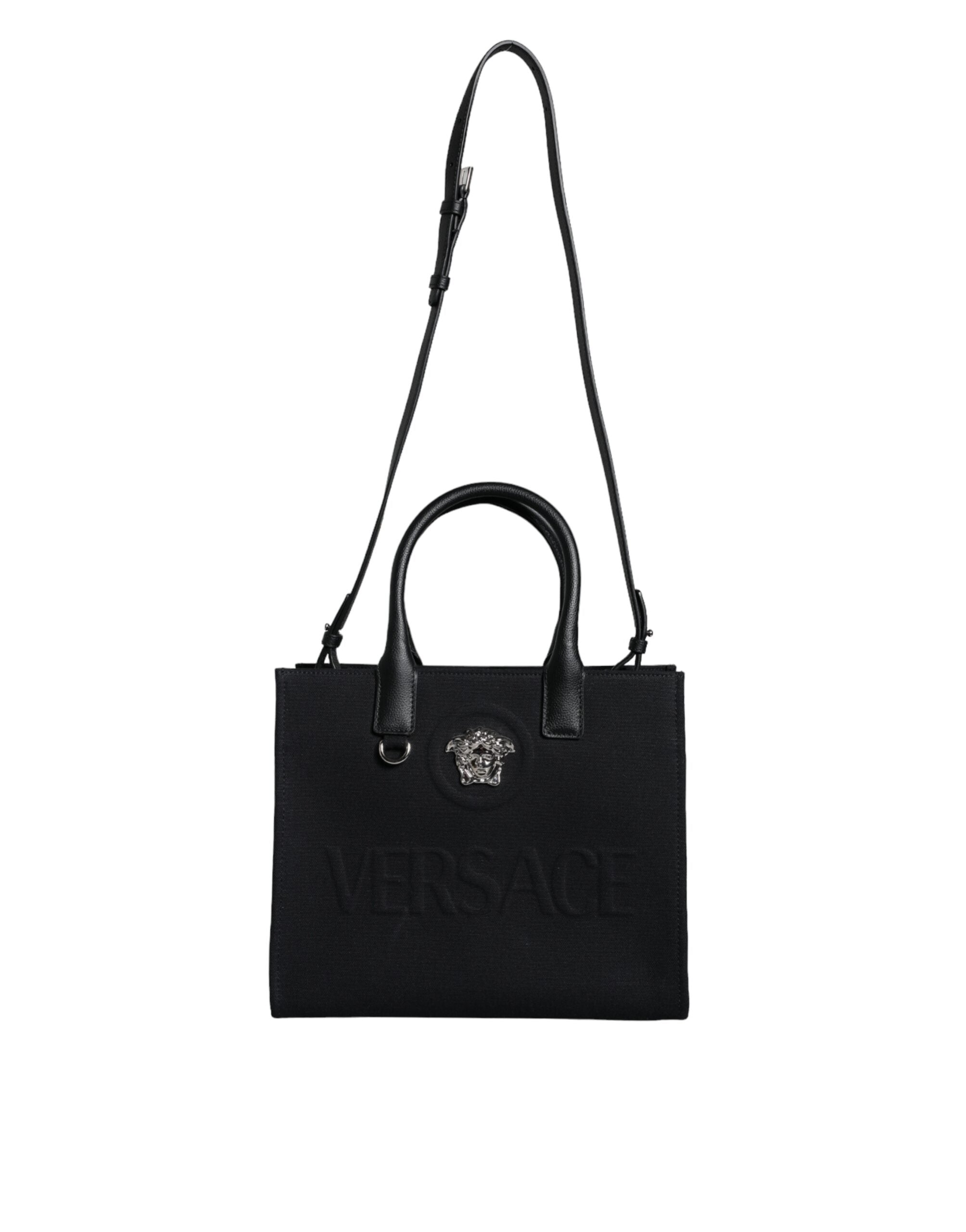 Bolso tote cruzado Versace de lona y cuero con asa superior en color negro y logotipo
