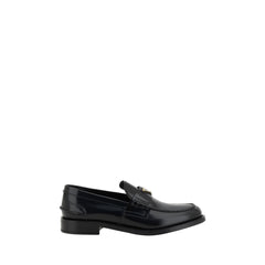 Mocasines de cuero negro con logotipo de Prada