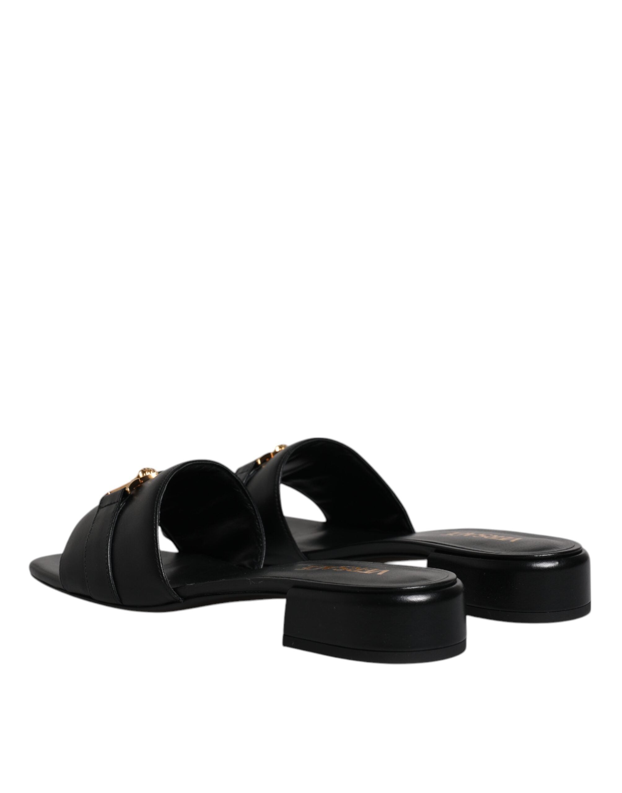Sandalias planas Versace de cuero negro con placa del logotipo