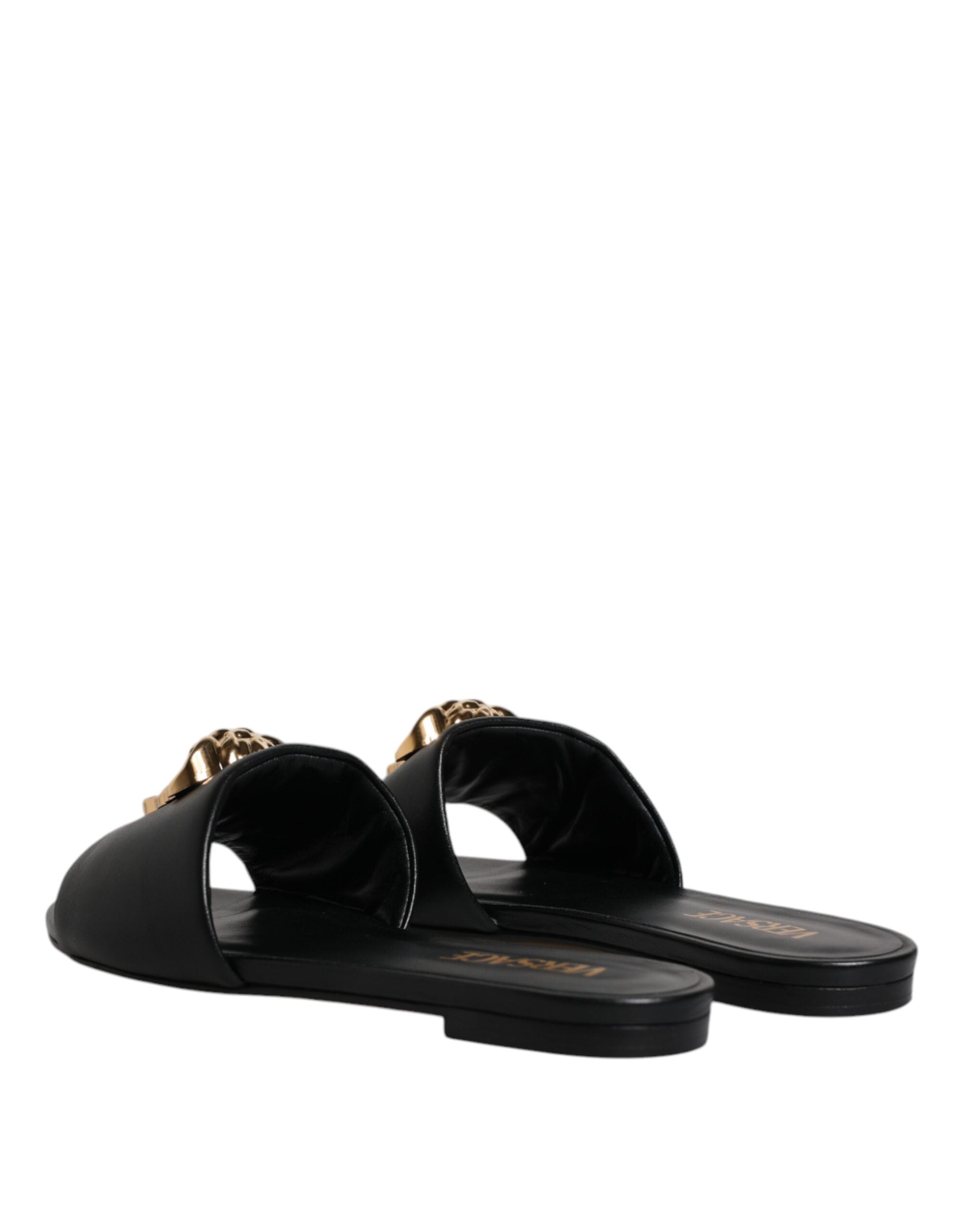 Sandalias planas Versace de cuero negro con placa del logotipo