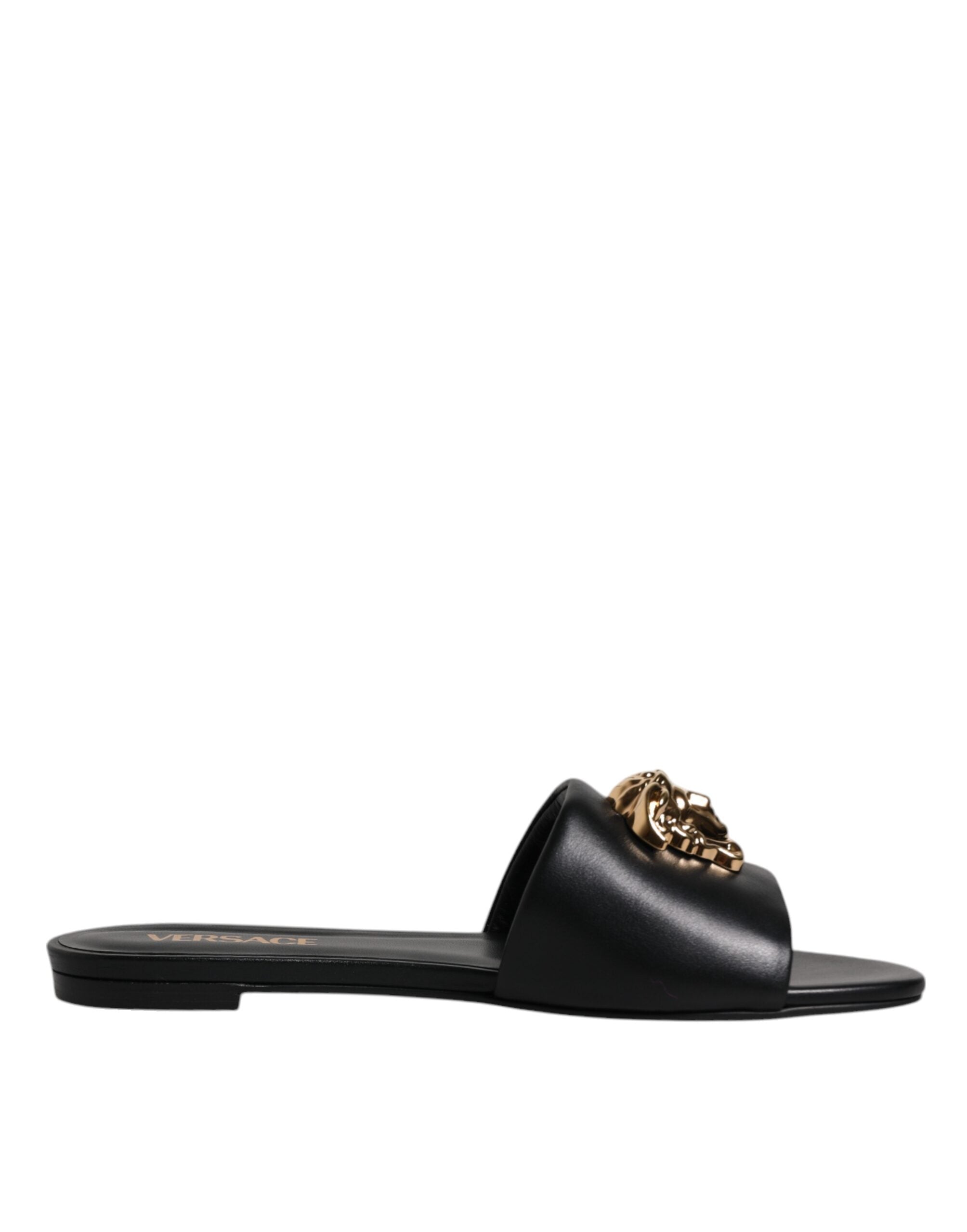 Sandalias planas Versace de cuero negro con placa del logotipo