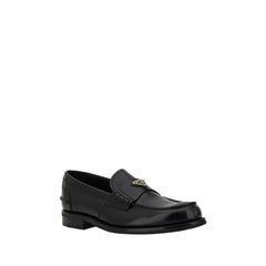 Mocasines con placa triangular de Prada