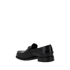 Mocasines con placa triangular de Prada