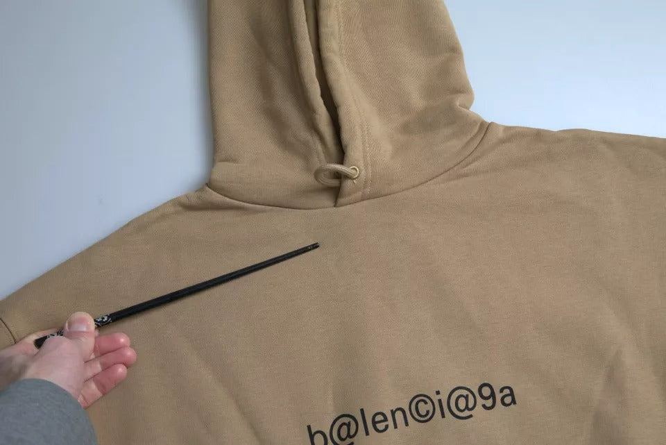 Suéter con capucha y bouclette de algodón marrón simbólico de Balenciaga
