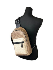 COACH West - Mochila bandolera de cuero con bloques de color, color arena