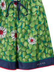 Pantalones cortos de seda con estampado de flores verdes de Gucci