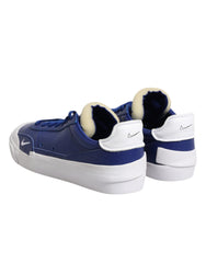 Zapatillas Nike blancas y azules con cordones y caña baja tipo drop-type PRM